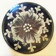 MUD Flower on enamel button