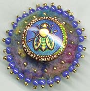 Bee button on felt