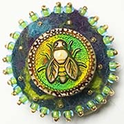 Bee button on felt
