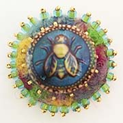 Bee button on felt