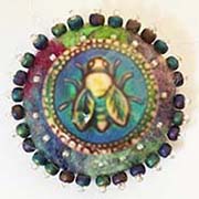 Bee button on felt