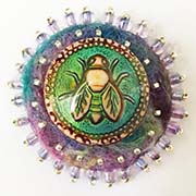 Bee button on felt