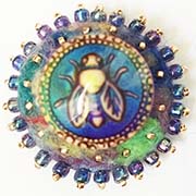 Bee button on felt