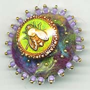 Bee button on felt